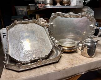 Lovely silver platters and other silver pieces.