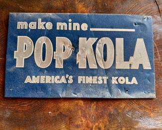 Locally historic vintage Pop Kola sign.