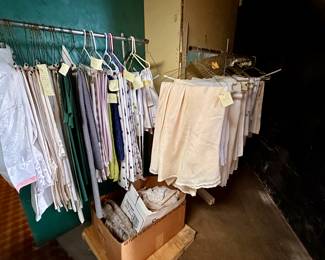 Racks of tablecloths in various sizes and colors.