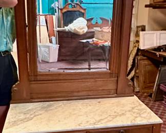Eastlake dresser/commode.  Hand-carved walnut with marble top and pivoting mirror.  Matches Eastlake twin-bed also available.