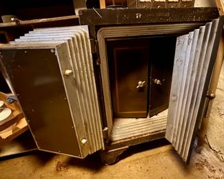Old and very heavy two-door safe with inner doors.  Locking mechanism works smoothly and the combination is available.  Shown with doors opened.