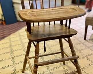 Vintage wooden baby high chair.