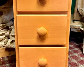 Painted three drawer night stand.  Lighting makes it look orange in this picture but in real life, it is pink.