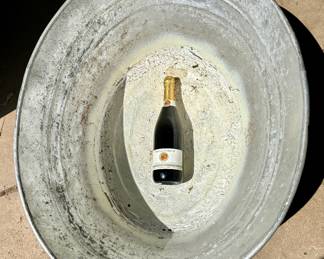 Extra large tub.  Sparkling wine bottle shown for size reference.