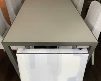 A Simply Done Design & Interiors Custom Designed One-Of-A-Kind Opaque Glass & Wood Dining Table. Measures 124" W x 41" D x 30" H with 28" Clearance. Shown With A Pair of Schumacher Upholstered Arm Chairs and A Set of 8 Simply Done Designed Dining Chairs Upholstered in Elitis Fabric. Photo 3 of 6.