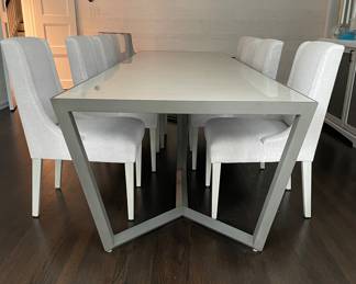 A Simply Done Design & Interiors Custom Designed One-Of-A-Kind Opaque Glass & Wood Dining Table. Measures 124" W x 41" D x 30" H with 28" Clearance. Shown With A Pair of Schumacher Upholstered Arm Chairs and A Set of 8 Simply Done Designed Dining Chairs Upholstered in Elitis Fabric. Photo 2 of 6. 