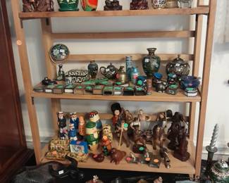 More cloisonne, lots of oriental figures, Russian nesting dolls, carved wooden old sailors