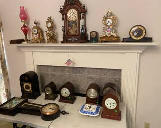 Several mantle and shelf clocks
