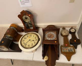Several mantle and wall clocks