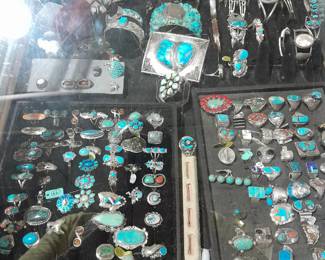 Case full of silver and turquoise rings and bracelets including an awesome ketch (bow guard)