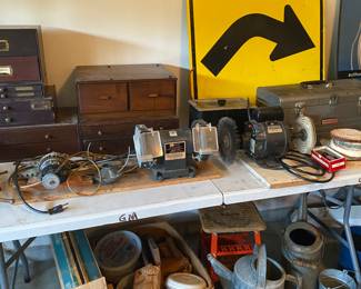 2 table top grinders. Watering cans.
Several parts drawers.