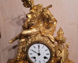 French gilt metal figural clock..19th century