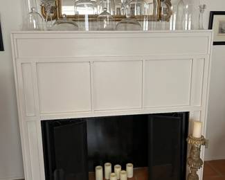 Faux fireplace surround once used as decor in a retail store. Clear glass cloche collection & another beautiful vintage mirror 