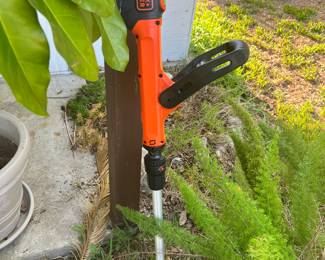 Two cordless weed eaters.  Yard tools, blower,  extension cords. 