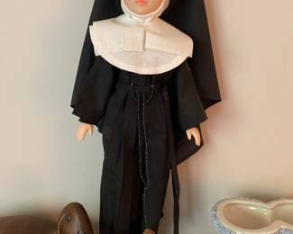 This nun does not like that duck nibbling on her toes.