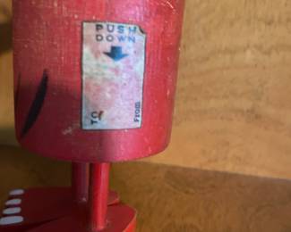 What does it do when you push down on this friendly little fellow?