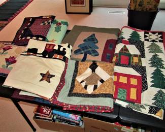 Many hand-made quilts