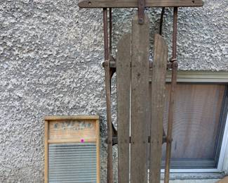 Antique sled and wash board.