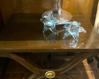 One of two small side tables