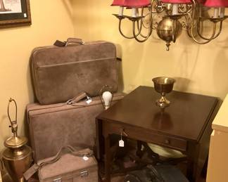 Light fixtures, luggage, side table