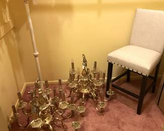 Two  heavy brass chandeliers; one of two stools