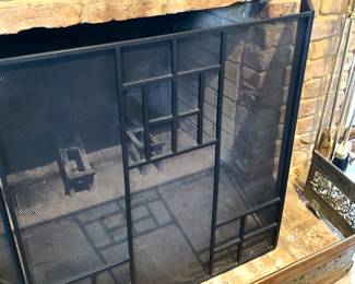 Black fireplace screen; brass fire fender