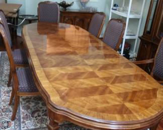 Drexel  Heritage  dining  room  table  and  chairs.  It  has  pads  and  two  leaves.  Table  is  72"  x  42"  without  the  leaves.  The  leaves  are  21  1/2"  each.