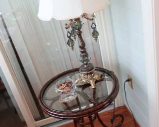 round  glass  top  table  with  metal  base       -           metal  and  marble  lamp  (lamp  is  sold)
