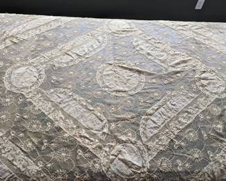 16.)  19th Century Normandy Lace Bedspread Embroidered on Swiss Linen Batiste and net.  French with silk liner.  Silk lining intact.  Some staining.  Structurally sound.  82" x 92"  $450.00  Sale:  $315.00