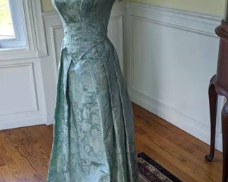 5.)  ca 1840's   Sea foam blue/green brocade 2 piece gown.  Mainly hand sewn.  Boned bodice.  Hook and eye closure.  Some underarm stains but no damage.  A few other tiny stains on bodice.  Very good condition.   Measures:  shoulder to shoulder 17",  Bust 30",  Waist 22"     $725.00  Sale:  $580.00