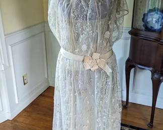 3.)  ca 1920's Embroidered lace bridal/wedding gown.  Satin bows.  Wearable.  Snaps in back.  1 small tear in netting at hem.   Excellent condition.    Measures:  shoulder to shoulder 13", Bust 32", Waist 32", Length 50".  $680.00  Sale:  $510.00