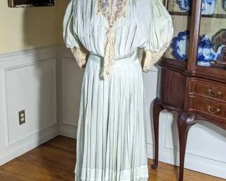 19)  ca 1897 Green dress with applied flowers - possibly a bridal/wedding dress.  There is a note with it mentioning a wedding and the year 1897.   It is unclear if it was a wedding dress or possibly part of trousseau.  Dress is in excellent condition but the inner lining is shattered.   $385.00 Sale:  $327.00
