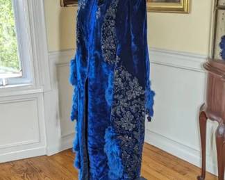 33.)  ca 1870's Blue Velvet Opera Mantle with beading, feathers, and tassels.  Velvet is a deep royal blue and heavily beaded.  Back of mantle has accommodation for bustle and is heavily beaded and feathered.  Some shedding of feathers.  Stunning!!  Near mint condition.  $1400.00  Sale:  $1050.00