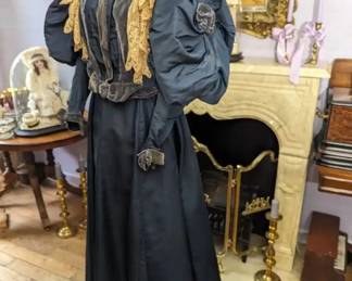 41.)  1890's Blue 2 Piece Costume with Velvet and Lace.  Large leg-o-mutton sleeves. Sleeves had a velvet flower.  Velvet cuffs.  Lace has 1 hole and is a bit fragile.  I believe the lace was added at a later date. Slight train.  1 light stain on the skirt - barely noticeable.  A few marks around the hemline.  Should clean out.  Overall, excellent condition.    Measures:  Bodice:  Shoulder to Shoulder - 13",  Bust - 22", Waist - 26",  Length - 19".  Skirt:  Waist - 25",  Length - 41",  Total Length - 60".   $465.00  Sale:  $325.00
