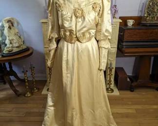 37)  1890’s Ivory Satin Bridal/Wedding Gown.  A few stains on skirt.  Dirt on edge of hem.  1 small wear spot on back.  Train.  Excellent condition.  Measures:  Shoulder to shoulder – 13”, Bust 35”, Waist – 28”, Length  - 58”.  $465.00  Sale:  $372.00
