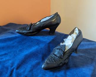 5.)  Antique beaded black leather evening shoes.  Labeled Sager, Brunner, Juley Shoe Co.  Green Bay, Wis.  Some creasing to the leather, but overall condition is very good.  Measures 9 1/4" long x 2 3/4" wide.  $98.00