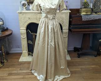 44.)  ca 1840's Satin Wedding Dress with watch pocket.   Aside from a couple of small stains the dress is in excellent condition.  Measures:  Shoulder to shoulder - 13", Bust - 24",  Waist - 30",  Length - 58".    $695.00