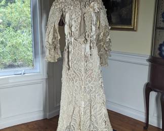 43.)  Belgian Tape Lace 2 Piece Ensemble with Silk Ribbons and Netting.  Silk Chiffon.  Bustle appropriate.  Hook and eyes on netting missing and minor repairs to lace needed.  No waistband.  Not sure if there ever was one.  Purchased in Berlin.  Mangnificent gown!!  Measures:  Top:  Shoulder to shoulder - 14", Bust - 30", Waist - 20".  Skirt:  Waist - 22", Length - 41", Length with train - 53".  $ 3500.00