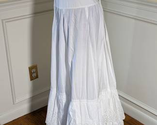 1.)  Fancy Eyelet Petticoat with pocket.  Ties and button at waist.  1 small hole near pocket.  Measures:  Waist  - 28", lenght - 38".  $125.00