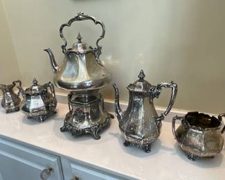 English Sterling Tea Service -$2,200.                              Antique Silver Plate Kettle on stand-$300