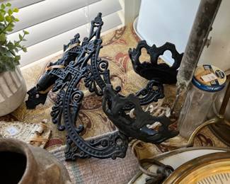 Cast iron wall - mount oil lamp brackets