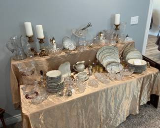 Another table full of fine china and glassware