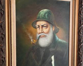 Framed signed painting of a sea captain. 