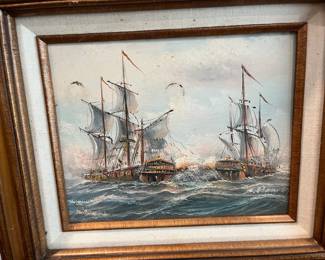 Another framed oil painting of two ships (at war perhaps?) 