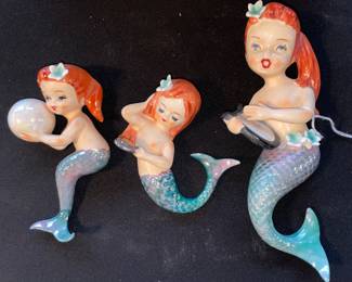 One arm has been repaired on mermaid on left