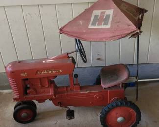 vintage pedal car Farmall tractor with cloth canopy