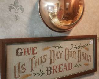 lots of cross-stitch, needlepoint, several cooper pieces of decor