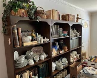 Loaded shelves in the front room. The shelves stay with the family. Everything else goes!