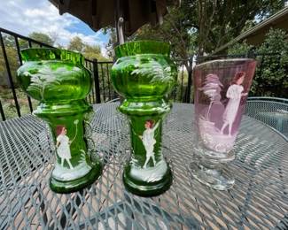 The pink one on the right is an antique Victorian hand blown Mary Gregory Vase Cranberry