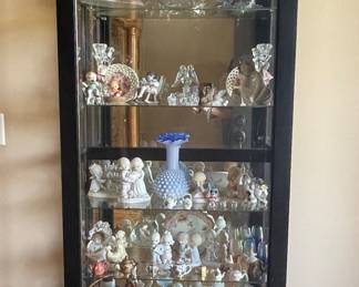 Lovely lighted curio cabinet to hold all of your precious items.